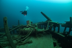 Diver exploring the windlass and anchor of the barque Arabia - Tobermory, Canada